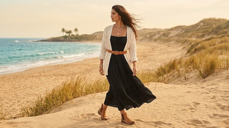 Woman wearing a flowing black boho midi dress styled with bohemian accessories for an effortless outfit inspired by relaxed, feminine fashion.