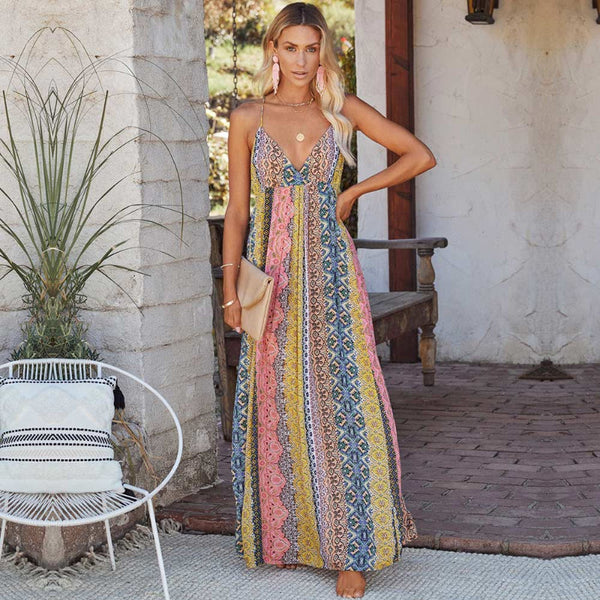 Woman wearing a pink spaghetti strap summer maxi dress from Boho Beach Hut Plus Size Boho Clothing Collection.