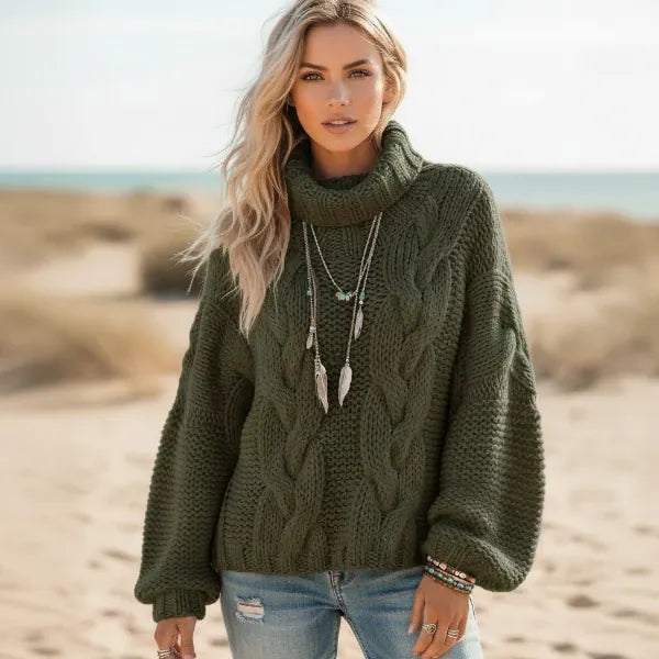 Woman wearing army green boho chunky knit turtleneck sweater with wide sleeves