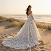 Bride turned around wearing a white off-the-shoulder floral lace ball gown wedding dress with sweetheart neckline, long illusion sleeves, embroidered lace, and dramatic court train.