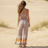 Back view of the Boho Blush Floral Print Crop Top & Wide Leg Pants Set featuring a blush pink floral print, smocked crop top, high-waisted wide leg pants, and relaxed boho matching set for women.