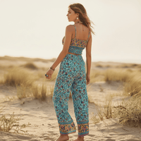 Back view of turquoise floral boho wide leg pants and crop top matching outfit