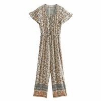Beige Boho Floral Wide Leg Jumpsuit with pockets featuring a breathable rayon-cotton blend, V-neckline, flutter sleeves, adjustable drawstring waist, front button detail, and neutral floral paisley print.