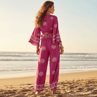 Back view of a boho fuchsia print kimono and wide leg pants set featuring flowing bell sleeves, wide leg pants, and a lightweight bohemian silhouette.