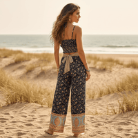 Back view of midnight blue floral boho wide leg pants and crop top matching outfit