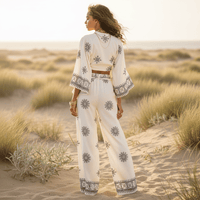 Back view of a boho off white print kimono and wide leg pants set featuring a flowy silhouette, wide leg pants, and neutral bohemian print.