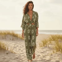 Woman wearing a boho olive green print kimono and wide leg pants set with a tie-front top, relaxed fit, and lightweight bohemian resort style.