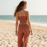 Back view of the Boho Rust Floral Print Crop Top & Wide Leg Pants Set featuring a rust bohemian floral print, smocked crop top, high-waisted wide leg pants, and relaxed boho matching set for women.
