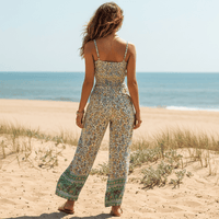 Back view of the Boho Sage Green Floral Print Crop Top & Wide Leg Pants Set featuring a sage green floral print, smocked crop top, high-waisted wide leg pants, and relaxed boho matching set for women.