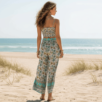 Back view of the Boho Turquoise Floral Print Crop Top & Wide Leg Pants Set featuring a smocked crop top, high-waisted wide leg pants, and turquoise floral boho print.