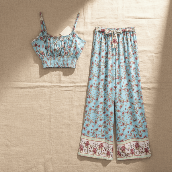 View of light blue floral boho wide leg pants and crop top matching outfit