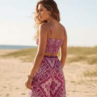 Back view of pink floral boho wide leg pants and crop top matching outfit