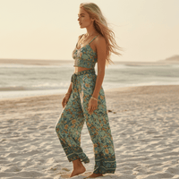 Back view of seafoam floral boho wide leg pants and crop top matching outfit