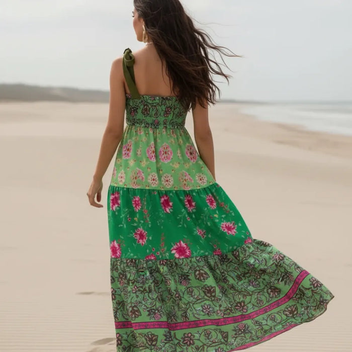 Back of green boho floral maxi dress with ribbon tie straps, stretch bodice and colorful tiered patchwork skirt