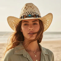 Beige beaded straw cowgirl hat with turquoise-colored beads and boho western woven cowboy design