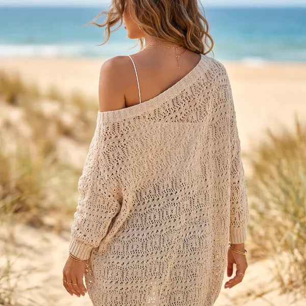 Women’s boho knit cardigan featuring a delicate hollow-out crochet pattern across the back and relaxed long sleeves.