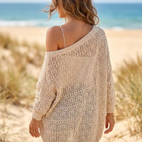 Women’s boho knit cardigan featuring a delicate hollow-out crochet pattern across the back and relaxed long sleeves.
