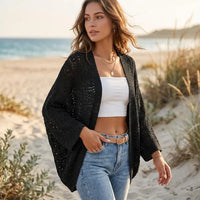 Black boho crochet cardigan with batwing sleeves and delicate open-knit detailing for casual everyday layering.