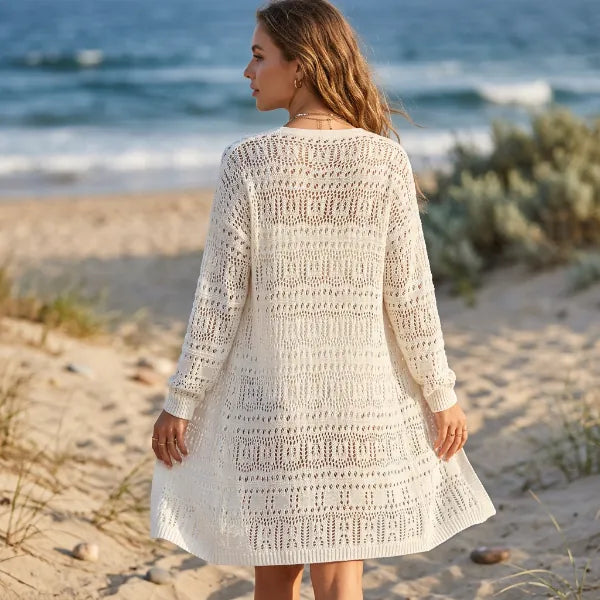 Women’s lightweight crochet-style cardigan featuring textured open-knit detailing and long sleeves.