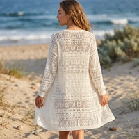 Women’s lightweight crochet-style cardigan featuring textured open-knit detailing and long sleeves.