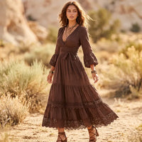 Brown boho long sleeve maxi dress with V-neckline, empire-inspired waist, flowing tiered skirt, and delicate lace ruffle trim.