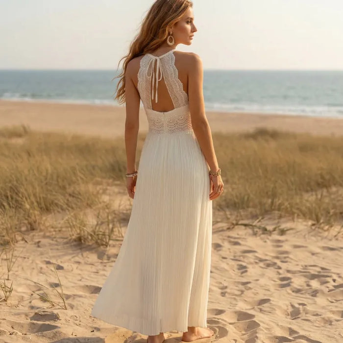 Back of white lace open back keyhole maxi dress with tie detail, spaghetti straps and empire waist