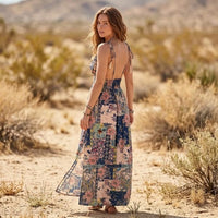 Back view of a floral patchwork maxi dress featuring adjustable spaghetti straps, an open back, smocked waist, and flowing skirt.
