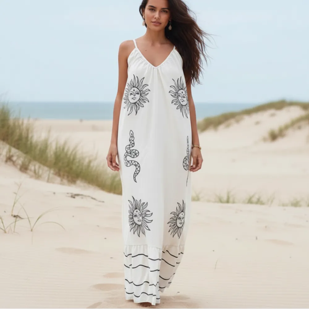 White boho floral maxi sundress with black print, spaghetti straps, V-neck, open back and flowy A-line skirt