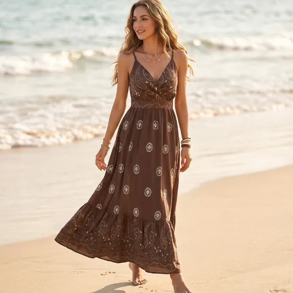 Brown boho paisley maxi dress featuring spaghetti straps, a feminine V-neckline, and flowing ankle-length skirt.