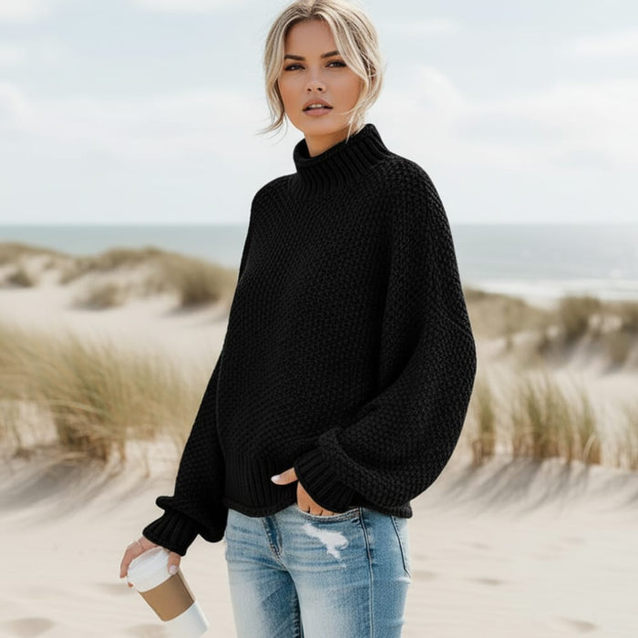 Women’s black mock neck sweater with relaxed fit and ribbed trim