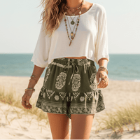 Olive Grove boho floral high waist drawstring shorts with pockets in breathable cotton rayon featuring a botanical print and ruffle hem for summer vacations, beach days, and casual bohemian outfits.
