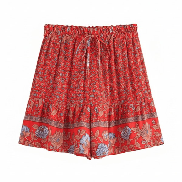 Scarlet Blossom boho floral shorts with a high waist drawstring waistband, lightweight rayon fabric, relaxed flowy fit, feminine ruffle hem, and a vintage-inspired floral border in vibrant scarlet red.