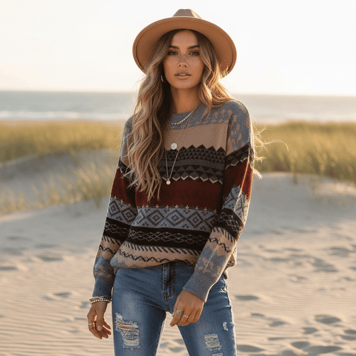 Woman wearing a burgundy, gray, black and brown boho geometric knit pullover sweater with long sleeves, O-neck and relaxed loose fit