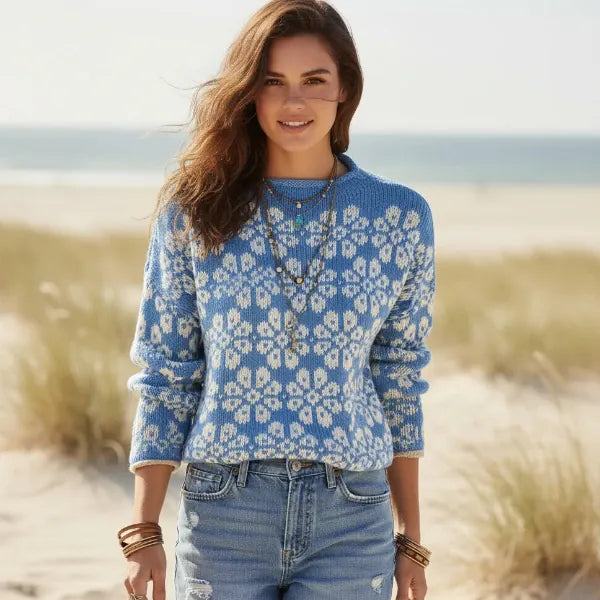 Woman wearing cornflower blue floral boho knit pullover sweater with long sleeves