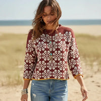 Woman wearing wine red floral boho knit pullover sweater with long sleeves