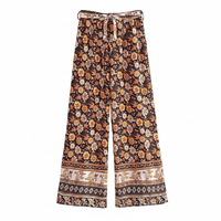Autumn Bloom boho wide leg pants with functional side pockets, a high waist drawstring waistband, lightweight rayon fabric, and a flowy floral palazzo silhouette.